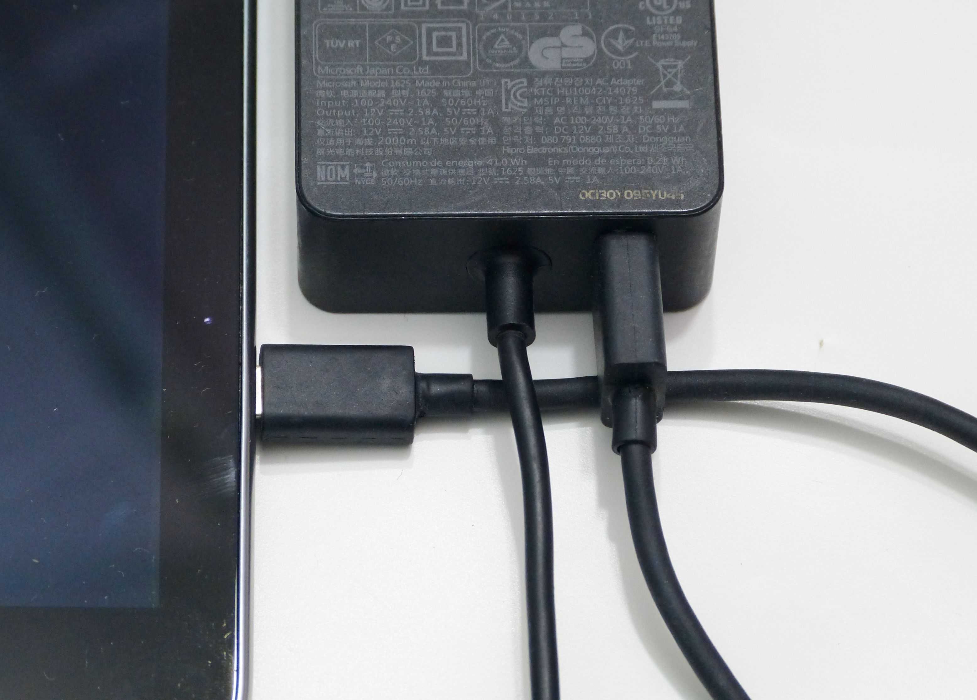 Surface Pro 3 power supply with 2A USB charging output.