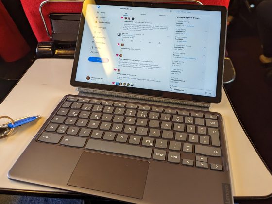 Lenovo Duet Chromebook on a seat-back table in a train
